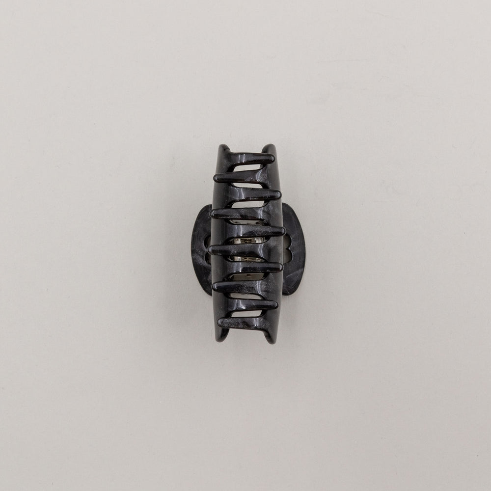 Haarspange "Night" in Draufsicht, zeigt Herz-Detail am Griff und leicht schimmernde Oberfläche.