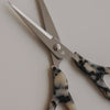Silberne Schere mit Griff im Leo-Design und kleinem Herzdetail als Nahaufnahme