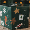 Grüner Adventskalender mit 24 Türchen und weihnachtlichen Motiven wie Lebkuchenmann, Stern und Bonbon