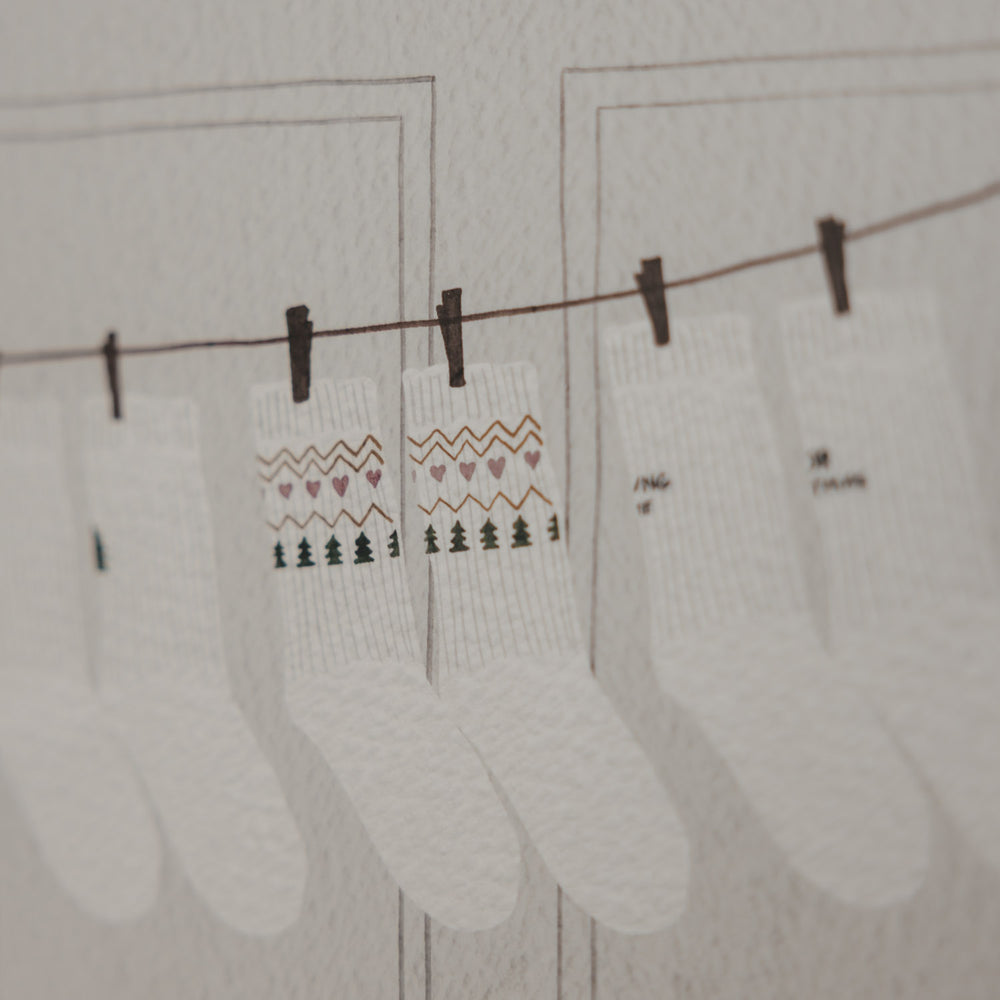Weihnachtliche Socken als Illustration auf dem Eulenschnitt Socken-Adventskalender für Paare