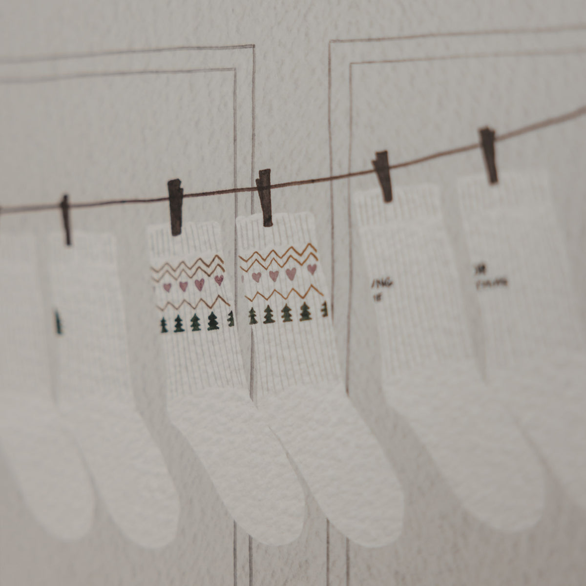 Weihnachtliche Socken als Illustration auf dem Eulenschnitt Socken-Adventskalender für Paare