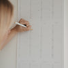Wandkalender 2027 im Einsatz mit handschriftlichem Eintrag
