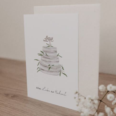 Klappkarte mit Illustration einer dreistöckigen Hochzeitstorte und Schriftzug 'Alles Liebe zur Hochzeit' auf hellem Hintergrund