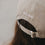 Detailansicht taupefarbene Cap mit Stickerei „ALL DAY“ und Metallverschluss