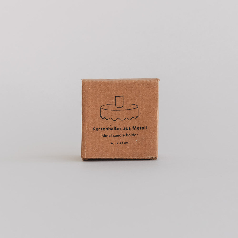 Verpackung des Kerzenhalters Welle aus Metall mit gezeichneter Produktabbildung auf der Vorderseite.
