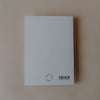 Rückseite einer Postkarte mit Eulenschnitt-Logo und Barcode auf hellem Hintergrund.