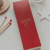 Rote Streichholzschachtel mit Schriftzug „All I Want for Christmas Is You“