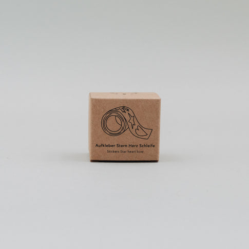 Kartonverpackung der goldenen Aufkleberrolle mit Motivdarstellung Stern, Herz, Schleife
