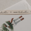 Beiges Geschenkband Frohe Weihnachten von Eulenschnitt mit schwarzem Schriftzug und kleinem Herz